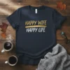 Happy Wife Happy Life quote printed in gold and white text on a dark t-shirt, representing relationship harmony