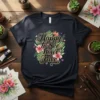 Happy to See Your Face quote on a dark t-shirt with pink flowers and green leaves, floral design