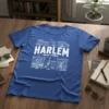 Harlem New York graphic t-shirt design with city buildings and text