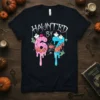 Haunted By 67 text with dripping numbers 6 and 7, decorated with ghosts and spiders, on a black t-shirt