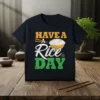 T-shirt with the text "HAVE A RICE DAY" in distressed orange and green font, featuring a bowl of rice and