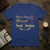 Blue t-shirt with gold text "Have a Very Blessed Good Friday" and a purple jeweled cross graphic