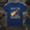Blue t-shirt with yellow text "HAVE THE DAY YOU DESERVE" and a colorful comet graphic