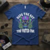 T-shirt with "Have the Day You Voted For" text and a neon-colored skull graphic with skeleton hands giving peace signs