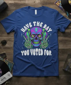 T-shirt with "Have the Day You Voted For" text and a neon-colored skull graphic with skeleton hands giving peace signs