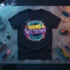 Black t-shirt with "HAVING A MELTDOWN" text inside a glowing circuit board circle, featuring neon colors and dripping effects