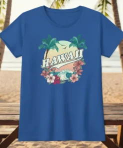 Hawaii text with tropical sunset, palm trees, ocean waves, and hibiscus flowers graphic on a blue t-shirt