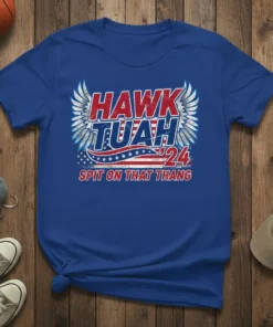 Hawk Tuah '24 Spit On That Thang text design with wings and American flag elements on a royal blue t-shirt