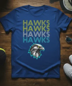Bold repeating text "HAWKS HAWKS HAWKS HAWKS" with a geometric eagle head graphic on a blue t-shirt