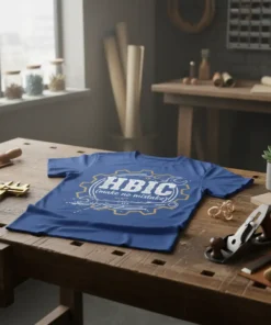 HBIC (make no mistake) text with gear and wrench graphic on a blue t-shirt