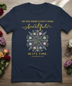 Navy t-shirt with gold text "HE HAS MADE EVERYTHING beautiful IN ITS TIME. ECCLESIASTES 3:11" and a floral mandala design