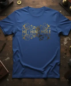 Blue t-shirt with gold ornate text reading "HE / HIM / HOLE" for pronoun pride, featuring steampunk-inspired gears and swirls