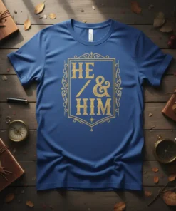 HE & HIM text in gold ornate frame on blue t-shirt, representing LGBTQIA pride and allyship