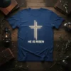 He Is Risen Christian T-Shirt with glowing cross design and gold accents