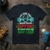 He Sees You When You're Lifting He Knows When You Skip Legs Christmas T-Shirt with Santa lifting weights graphic