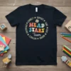 Navy t-shirt with colorful "HEAD START Team" text in a circle, surrounded by inspirational words and small daisy graphics