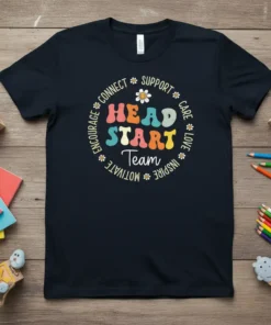 Navy t-shirt with colorful "HEAD START Team" text in a circle, surrounded by inspirational words and small daisy graphics