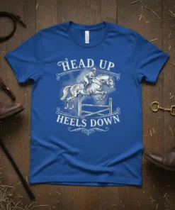 Head Up Heels Down equestrian t-shirt featuring a horse jumping a fence and rider