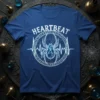 Heartbeat spider t-shirt design with a white spider graphic, ECG line, and runes on a blue shirt