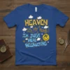 Heaven Is My Home! I'm Just Here Recruiting text design with smiley face and clouds on a royal blue t-shirt