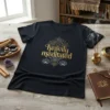 Black t-shirt with "heavily meditated" text in gold, featuring intricate mandala and lotus flower graphics