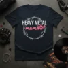 Heavy Metal Mama t-shirt design with barbed wire circle and neon pink "mama" text with a skull and bat wings