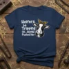 Funny cow t-shirt with text "Heifers be Tripping OK...MAYBE I Pushed Her" and a winking cow graphic wearing a bandana