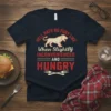 Hell Hath No Fury Like When Slightly Inconvenienced and Hungry quote on a navy t-shirt with a roaring lion graphic