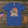 Hello COOL DUDE t-shirt design with a cartoon hot dog riding a motorcycle against an American flag circle