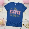 Hello ELEVEN EST. 2014 birthday t-shirt with pink and gold glitter text and a bow graphic