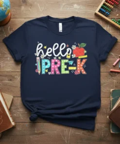 Hello Pre-K text with colorful alphabet letters, an apple, and school supplies graphic on a navy t-shirt