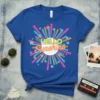Hello Sunshine text with retro sunburst graphic and colorful flowers and butterflies on a royal blue t-shirt