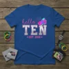 Hello TEN EST. 2016 text with colorful geometric crystals on a royal blue t-shirt, perfect for a 10th birthday celebration