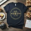 Hello Thirty Est. 1995 text in gold glittery font on a navy blue t-shirt, part of a birthday celebration theme