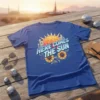 Here Comes The Sun retro graphic t-shirt with sunflowers, cacti, and a bright sun