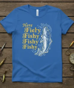 Blue t-shirt with yellow text "Here Fiery Fishy Fishy Fishy" and a jumping fish graphic, designed for anglers