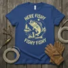 HERE FISHY FISHY FISHY t-shirt design with a jumping bass fish, trees, and sun graphic