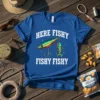 Blue t-shirt with white text "HERE FISHY FISHY FISHY FISHY" and a graphic of a fishing lure with a small