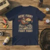 T-shirt with vintage style graphic of a bearded fisherman reeling in a fish, text "HERE FISHY FISHY FISHY FISHY" above