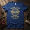 Blue t-shirt with gold text "HERE I AM SEND ME ISAIAH 6:8" and a cross with wings design