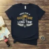 Here For A Good Time Not A Long Time text with wings and anchor graphic on navy t-shirt
