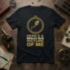Black t-shirt with gold text "Here's A Really Old Picture Of Me" and a cartoon sperm graphic inside a pocket