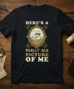 T-shirt with text "HERE'S A REALLY OLD PICTURE OF ME" and a graphic of a sperm wearing sunglasses in a