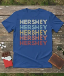 Retro HERSHEY HERSHEY HERSHEY HERSHEY HERSHEY text design in multiple colors on a royal blue t-shirt