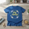 Blue t-shirt with "Hey Auntie!" text in yellow cursive, surrounded by a floral wreath with bees and butterflies