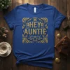 Hey Auntie text with vintage gold and blue ornate border on a royal blue t-shirt