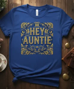 Hey Auntie text with vintage gold and blue ornate border on a royal blue t-shirt