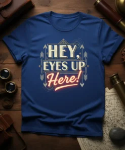 HEY, EYES UP Here! text design with decorative arrows and lines on a blue t-shirt