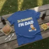 T-shirt with the text "Hi Hungry, I'M DAD" and a cartoon man holding a burger