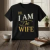 Black t-shirt with "HI, I AM The WIFE" text design in vintage gold and white lettering